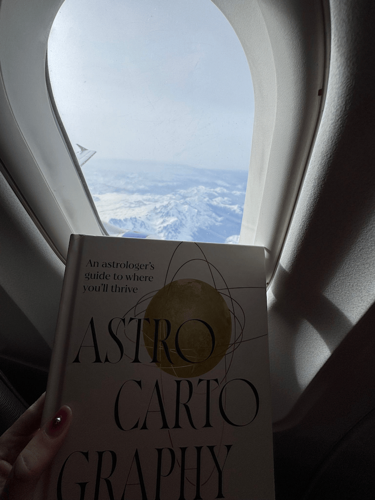 Astrocartography book on a plane