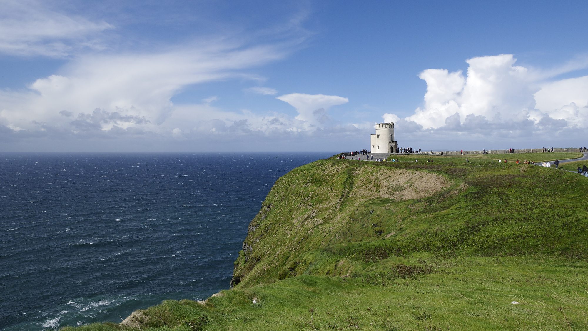 A signal tower on the headland above the Cliffs of Moher, Atlantic beyond